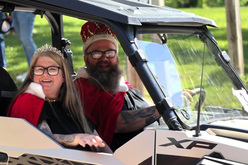 The King and Queen of Tivoli Fest ride in the parade.