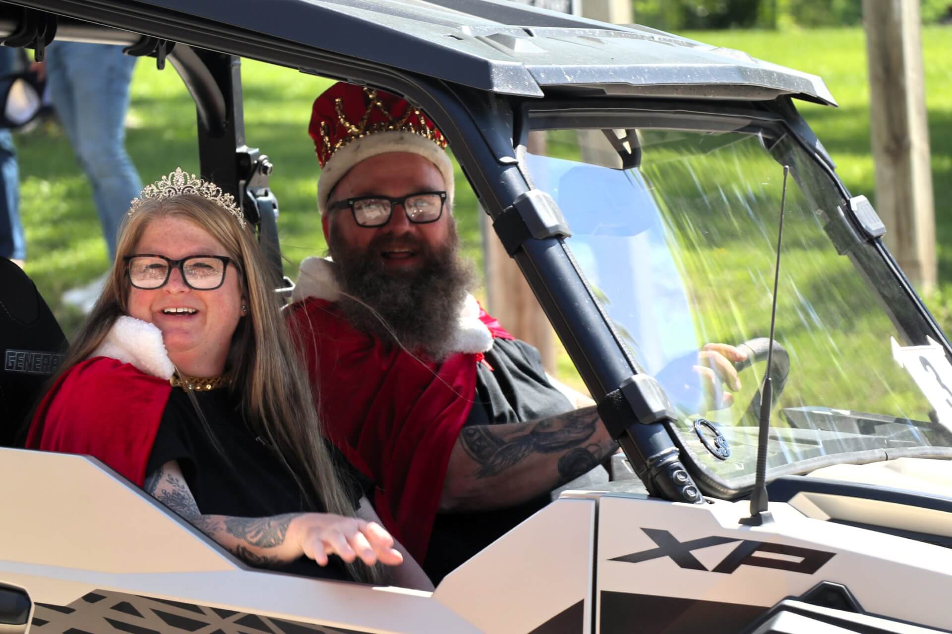 The King and Queen of Tivoli Fest ride in the parade.