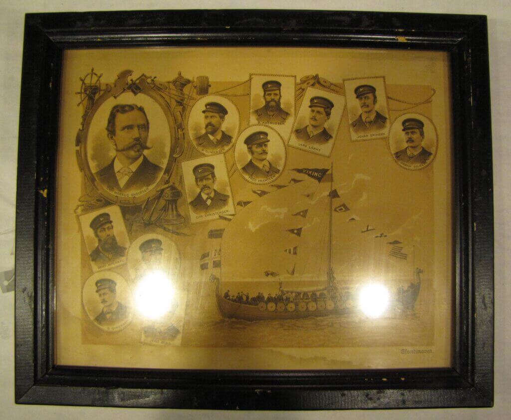 A brown print in a black frame. Twelve faces are in bubbled along the top and left side, while a Viking ship covered in flags is on the bottom right.