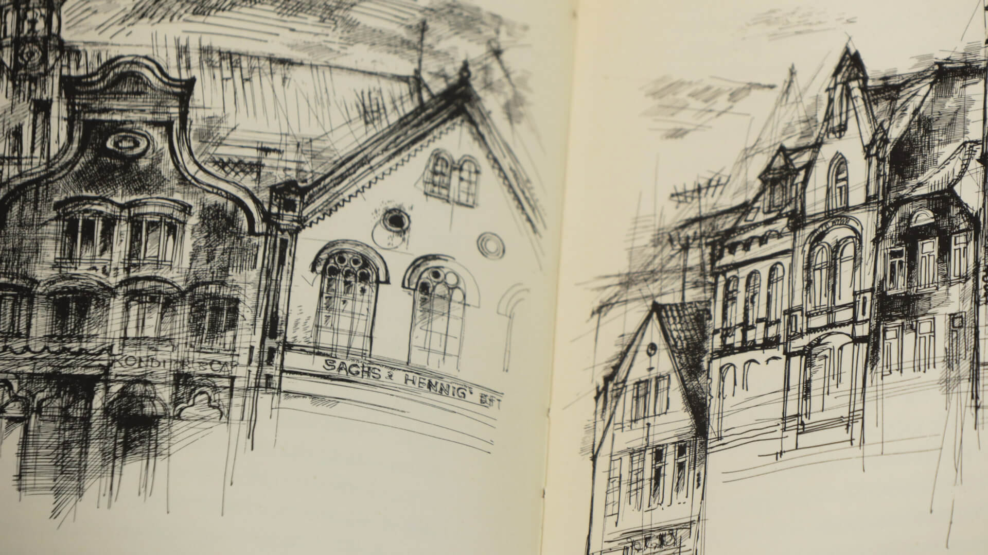 Book spread with complex illustrations of row houses.
