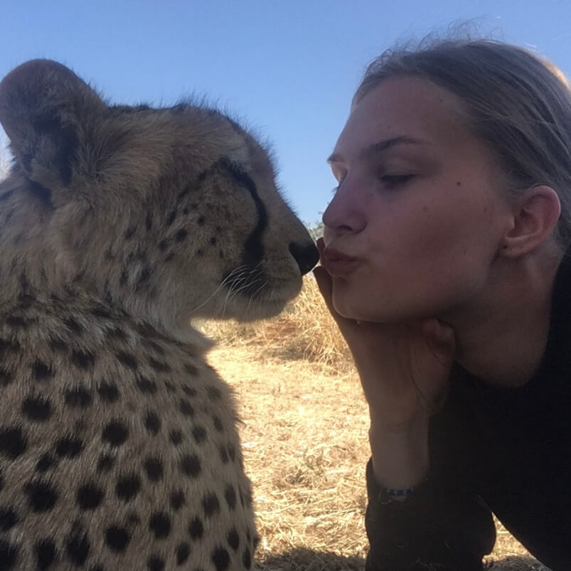 Nathalie Nielsen poses with a cheetah.