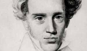 A drawing of a young man with curly hair.