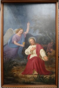 Painting of Jesus kneeling down. On the left is an angel coming down to hand Jesus a goblet.