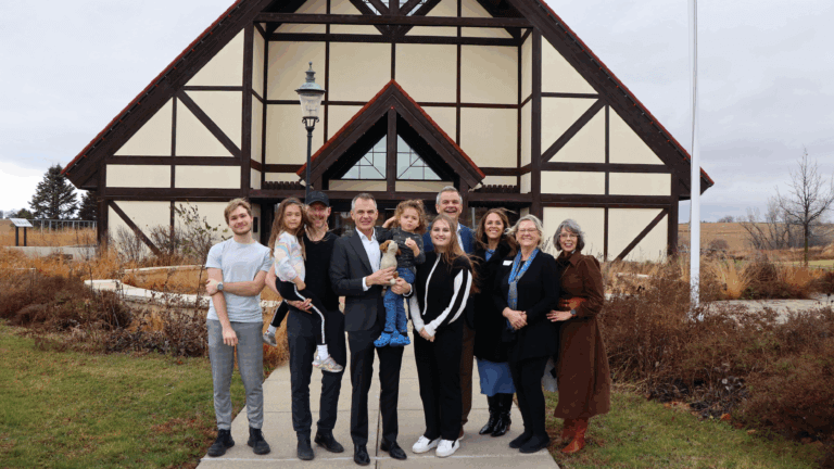 Museum of Danish America staff with the Danish Ambassador and his family in front of the Museum of Danish America.